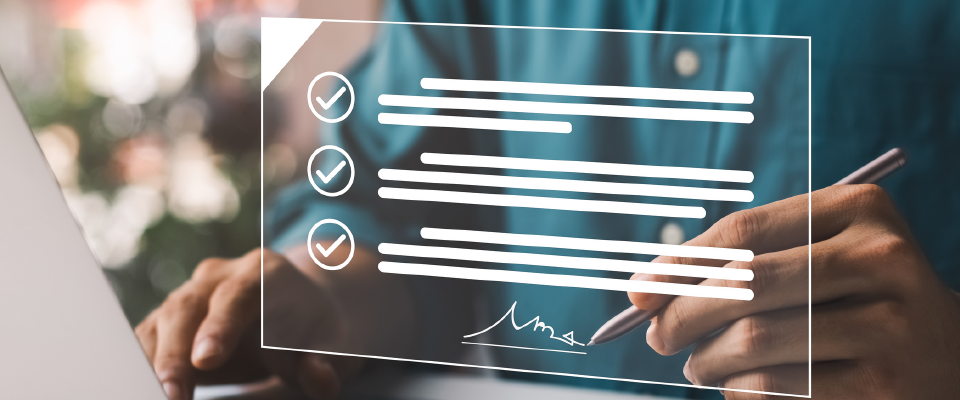 Photo of checkmarks and man signing name at the bottom of the page